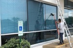 Professional window cleaner washing windows